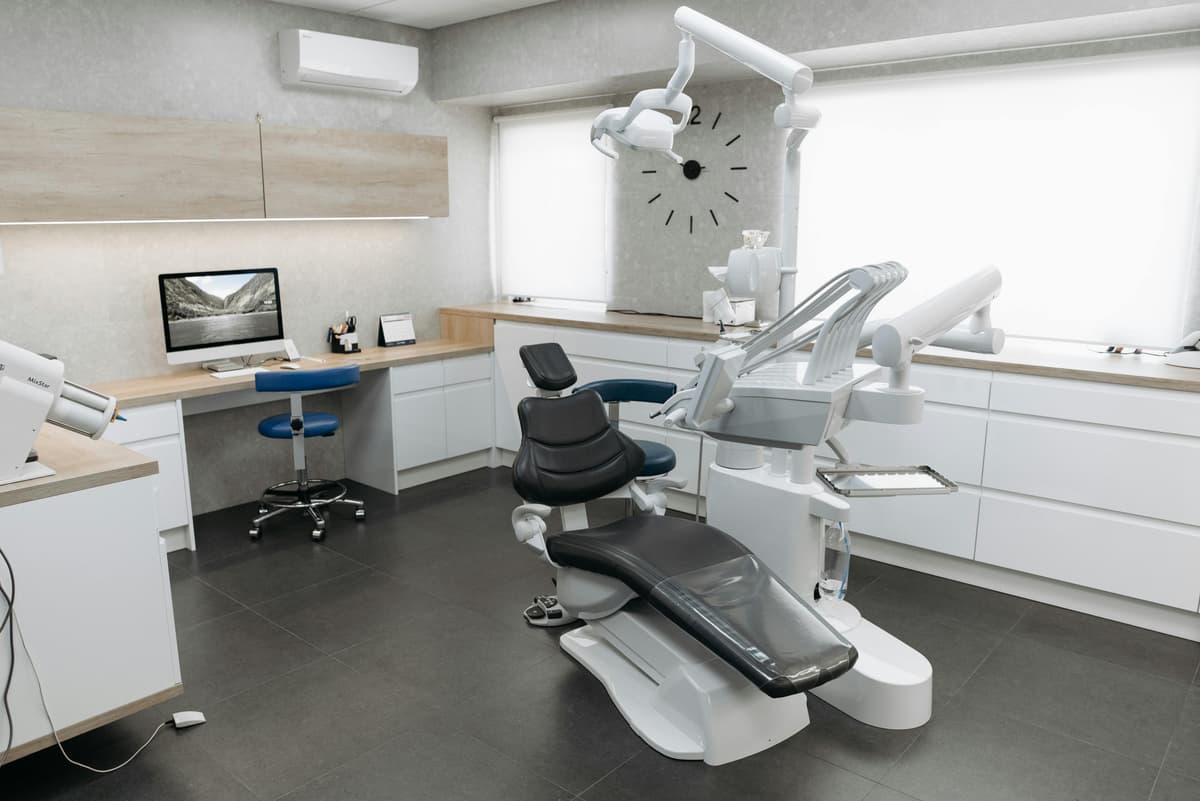 Modern dental clinic interior with chair and equipment
