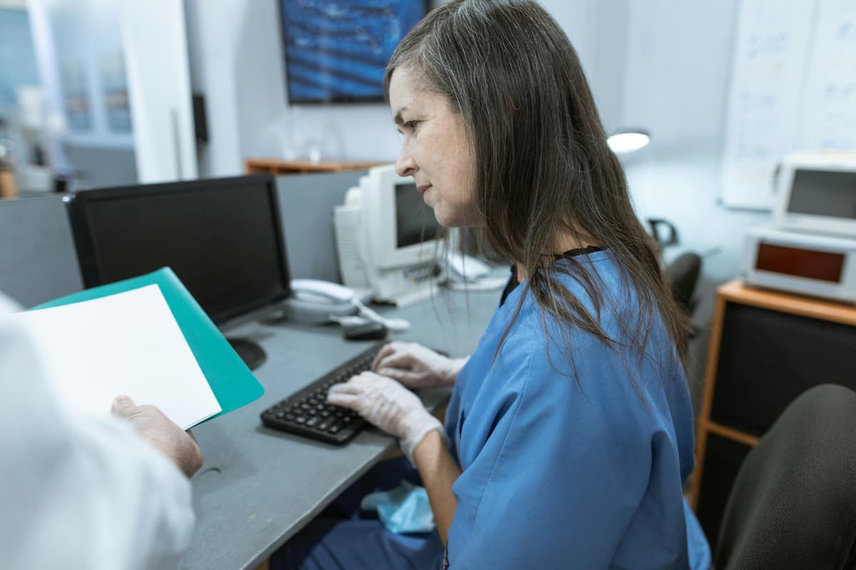 Medical front desk with desktop computer in a bright clinic